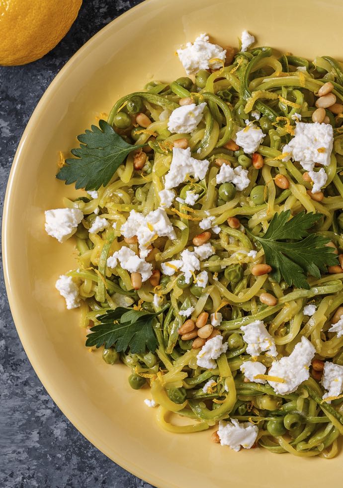Homemade Courgette Spaghetti Pasta with Pine nuts and Feta, top view.